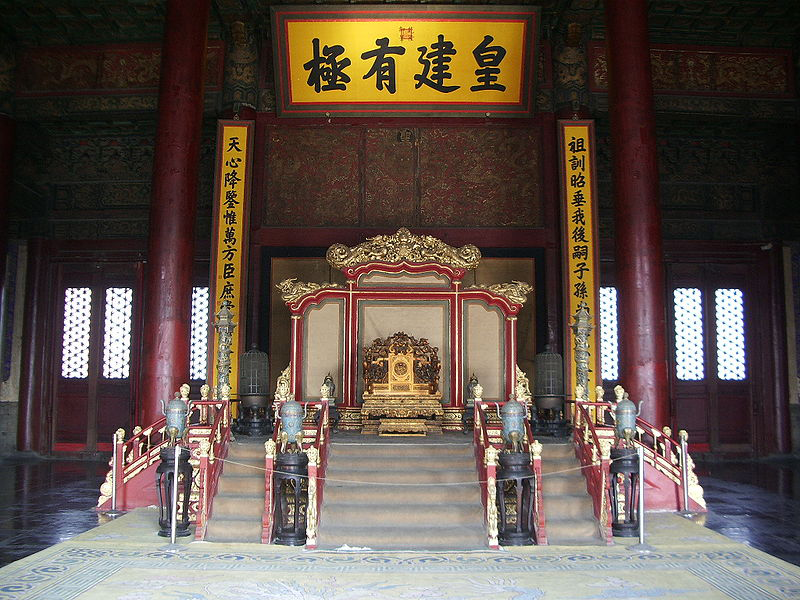 The throne in the Hall of Preserving Harmony with emblem's and small shrine markers in the front